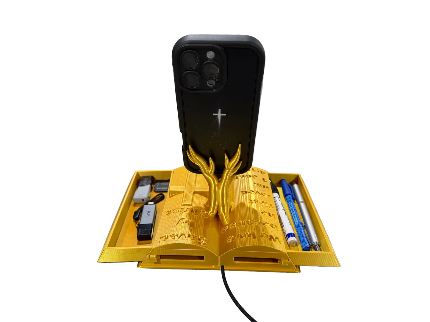 Christian Gift for Men & Women – Bible Verse Phone Stand | 1 John 4:19 | “Saved by Christ” Engraved Cross | Faith Desk Organizer